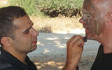 A lesson in applying camouflage paint from LionOps founder Bar-Or, far left, in Mount Carmel National Park