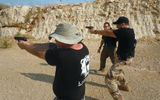 At LionOps' West Bank training facility, learning to aim pistols...