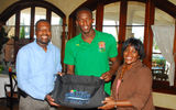 Clifton Reader, GM of Sunset Jamaica Grande Resort & Spa (left) Charmaine Deane, the hotel's dir. of corporate communications (right) welcome Usain Bolt to the property.