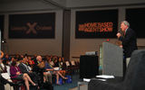 Bob Sullivan, Travel Weekly group publisher, addresses trade show attendees