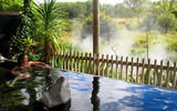 Rotorua is home to a range of geothermal pools where visitors can enjoy a relaxing soak. A bather enjoys the view from this public pool heated by the Te Manaroa spring, New Zealand's largest single source of naturally boiling water, at the Waikite Valley Thermal Pools facility.