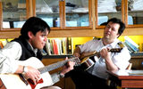 The Spirit of Endeavour's Captain Fleming (right), playing guitar with Kevin Skeek, the Huna Cultural Interpreter brought onboard in Glacier Bay.