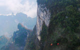 Visitors can journey up to Tianmen Mountain on board the longest mountain cableway in the world, traveling 4.5 miles from Zhangjiajie's city center to the limestone formation's peak.