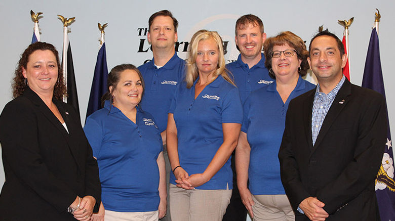 CruiseOne awarded free travel franchises to five U.S. military veterans who won its third annual “Operation Vetrepreneur: Become Your Own General” contest. Nearly 150 veterans submitted applications for this year’s contest. Front row, from left: Debbie Fiorino of CruiseOne; Air Force veteran Ingrid Markham; Army and National Guard veteran Tammy Duffield; Navy veteran Marci Dewitt; and Tim Courtney, CruiseOne. Back, from left: Navy veteran Craig Markham and Marine Corps vet Conrad Carpenter
