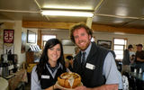 Wright and Whaley hold a famous, monster-sized cinnamon bun at the Braeburn Lodge, a stop along the Klondike Highway between Dawson City and Whitehorse.