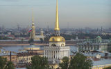 The slender, golden 18th century spires of the Admiralty and Peter and Paul Cathedral stand out amid the smokestacks and shipyard and construction cranes of latter-day St. Petersburg.