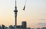 A jumper takes the plunge from the Auckland Harbour Bridge, with Auckland's Sky Tower in the distance. Photo courtesy of AJ Hackett Bungy