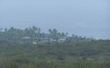 Vog, or volcanic smog, from Mount Kilauea blurs the view of the seaside Pu'uhonua O Honaunau National Historic Park.