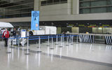 Pre-renovation check-in, dominated by van-sized X-ray devices for screening bags.