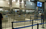 Approaching the passport control area, newly outfitted with high glass panels for increased privacy, and brighter, more energy-efficient lighting.