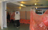 Corridor leading to gate areas, complete with construction netting.