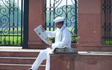 A latter-day prime minister Nehru lookalike peruses a Hindi-language daily at Delhi's Red Fort.