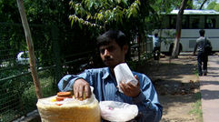Indians love their street food. Here, a vendor prepares a nut, spice and bean mix at Raj Ghat, the cremation site of Mahatma Gandhi and Indira Ghandi.