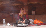 A Bedouin woman sells souvenirs on the pathway up to the tomb known as the Monastery. (photo by Arnie Weissmann)