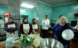 At the Petra Kitchen, tourists prepare their own traditional Jordanian food -- with a little help from Jordanian chefs. (photo by Arnie Weissmann)