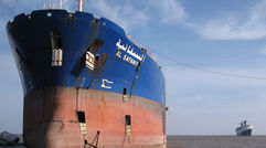 Among the iconic ships rusting in India's Gulf of Cambay is the tanker El Safinay and the former Blue Lady (background), which also served as NCL's Norway. (photo by Peter Knego)