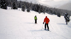 Skiers at the top of a slope at Lake Louise ski resort.