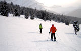 Skiers at the top of a slope at Lake Louise ski resort.