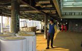 A worker at Fincantieri walks amid rolls of insulation on Deck 9 of the Queen Victoria while under construction.