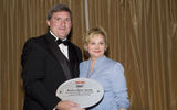 Georgia Kirshner, vice president of travel industry sales, the Ritz-Carlton Co., accepts the Best Luxury Hotel Chain award from Travel Weekly Publisher Bob Sullivan. (photo by Lisa Quinones/Black Star)