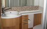 The cabin bathrooms are larger than on other Celebrity ships, and have an abundance of storage drawers and shelves. The showers are also larger and have a bar for leg-shaving.