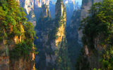 Located 630 miles north of Guangzhou, and less than two hours onboard regularly scheduled flights, the city of Zhangjiajie is a gateway to the Wulingyuan Scenic Area, a UNESCO natural World Heritage Site since 1992 that's spread across 135 square miles. Some of the preserve's Yuanjiajie quartz sandstone formations, seen here, stand more than 650 feet tall.