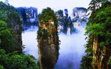 Regularly wreathed in low lying clouds, Yuanjiajie's quartz sandstone pillars inspired the floating islands of Pandora in the James Cameron film Avatar. Long known as Qiankun Zhu, the pictured formation has earned the more recent stage name of Avatar Mountain. Photo courtesy Zhangjiajie Tourism Bureau.