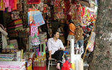 Vendors selling their wares at a street market in Hanoi.