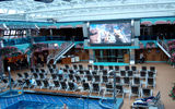 The Carnival Splendor's midship pool area includes a giant movie screen and a retractable roof. CEO Gerry Cahill called the area an "entertainment zone."