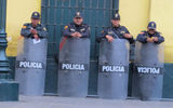 Friendly Patrol: Police invite visitors to pose with them, asking for nothing more than a smile.