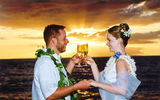Ronnie and Angela Points toast their nuptials at Maluaka Beach. (photo courtesy of Hawaiian Island Weddings)