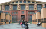 Taking an official tour of one's native stomping grounds is bound to be enlightening. When that home turf happens to be the adopted town of Walt Disney, and the tour is hosted by Adventures by Disney (ABD), things could have gone several ways. Pictured here, a family on the ABD tour poses in front of the Michael D. Eisner building, aka "the Seven Dwarfs building," at Walt Disney Studios. Photos by Michelle Baran; posted March 8, 2012