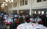 Servers have some down time before the inaugural gala dinner in the JM White Dining Room.