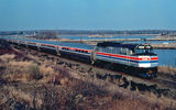 An F40 locomotive and Amfleet passenger cars, 1976.