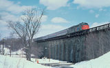 An E8 pulling a train during the winter.