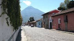 Long dormant and one of four volcanoes in the area, Volcan de Agua looms over the Antigua streetscape.