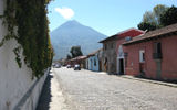 Long dormant and one of four volcanoes in the area, Volcan de Agua looms over the Antigua streetscape.