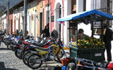 Motorbikes and scooters are another popular form of transportation on Antigua's cobblestone streets.