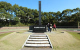 A black column marks ground zero below where an atomic bomb detonated above Nagasaki.