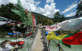 Prayer flags tied to a bridge in Bumthang region.
