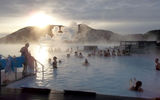 Visitors take a midwinter outdoors soak in the geothermal waters of the popular Blue Lagoon attraction near Reykjavik.