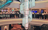 In a ceremony in New York May 8, Norwegian Cruise Line christened its newest ship, the 4,000-passenger Norwegian Breakaway. Pictured here, Norwegian Breakaway crew gathered in the ship's 678 Ocean Place before the christening. TW photo by Rebecca Tobin