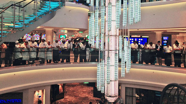 In a ceremony in New York May 8, Norwegian Cruise Line christened its newest ship, the 4,000-passenger Norwegian Breakaway. Pictured here, Norwegian Breakaway crew gathered in the ship's 678 Ocean Place before the christening. TW photo by Rebecca Tobin