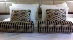 Windstar Cruises' Wind Surf recently completed the first phase of a face-lift, when a December drydock included redesigns of cabins, suites and hallways. Pictured here, an updated stateroom with a leather headboard and new bed linens and designer pillows. Photos by Donna Tunney; posted Jan. 20, 2012.