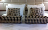 Windstar Cruises' Wind Surf recently completed the first phase of a face-lift, when a December drydock included redesigns of cabins, suites and hallways. Pictured here, an updated stateroom with a leather headboard and new bed linens and designer pillows. Photos by Donna Tunney; posted Jan. 20, 2012.
