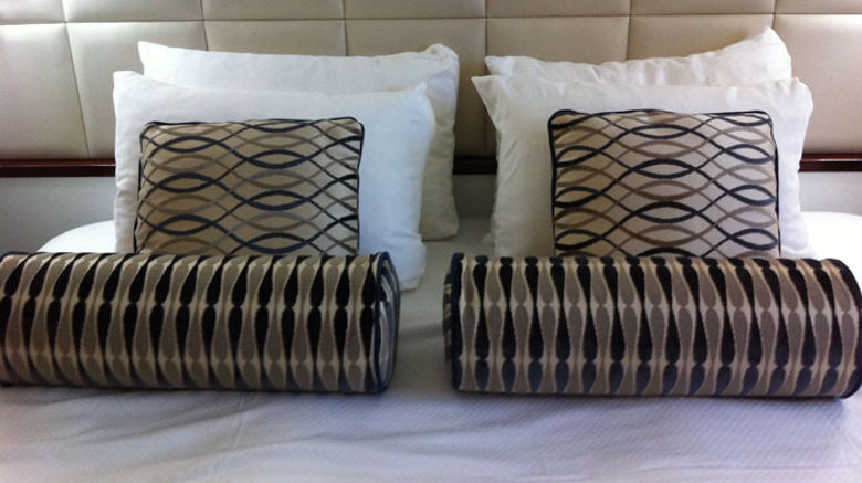 Windstar Cruises' Wind Surf recently completed the first phase of a face-lift, when a December drydock included redesigns of cabins, suites and hallways. Pictured here, an updated stateroom with a leather headboard and new bed linens and designer pillows. Photos by Donna Tunney; posted Jan. 20, 2012.