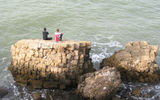 Local boys fish on the ruined Roman-era quay at Caesarea.