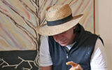 A potter in Bogota’s La Candelaria district demonstrating how he makes a cup on a wheel.