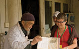 Abercrombie & Kent guests with a local doctor at his clinic in China's Yunnan province.