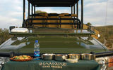 A four-wheel-drive game-viewing vehicle becomes a buffet during the evening “sun-downer” drive.